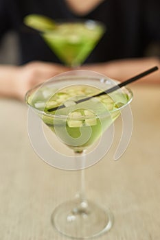 Two glasses of apple martini