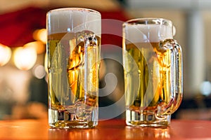 Two glasses with beer on the table, Tokyo, Japan. Close-up.