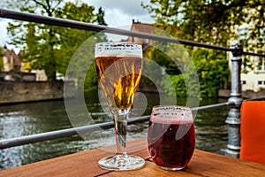 Two glasses of belgian beer standing on the table