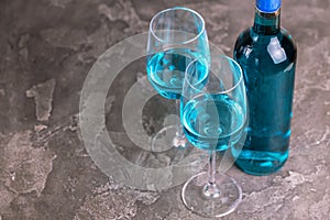 Two glasses and bottle of trendy blue wine. Spanish chardonnay
