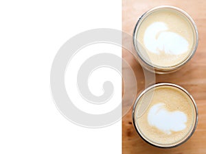 Two glasses with cappuccino or latte. place for text. coffee on a background of a table from a cafe. top view