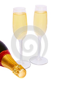 Two glasses of champagne with bottle