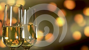 Two glasses of champagne with bubbles on golden blinking background.