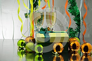 Two glasses of champagne with Christmas tree branch