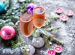 Two glasses of champagne with Christmas tree branch