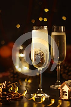 Two glasses with champagne in New Year Eve style