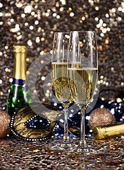 Two glasses of champagne at New Year`s Eve party golden shiny background stock images