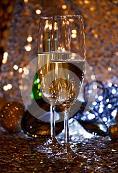 Two glasses of champagne at New Year`s Eve party golden shiny background stock images