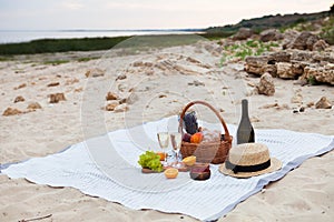 Two glasses of champagne. Picnic on the beach at sunset in the w