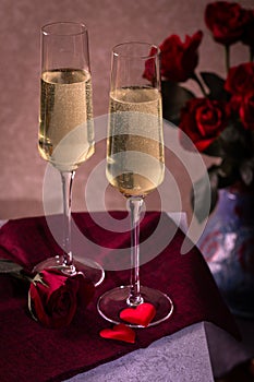 Two Glasses of Champagne and Red Roses