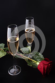 Two glasses of champagne with rose