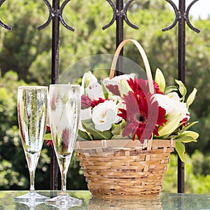 Two glasses of champange and flower basket