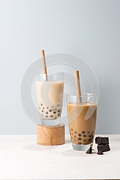 Two glasses of chocolate boba tea/ buble tea on white background