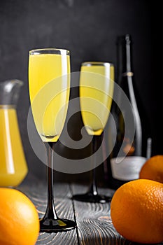 Two glasses with a Christmas drink. Mimosa cocktail. Champagne with orange juice