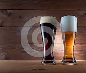 Two glasses of different colored beer