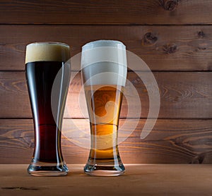 Two glasses of different colored beer