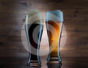 Two glasses of different colored beer