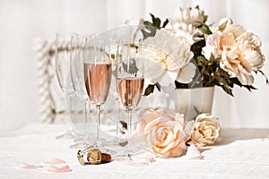 Two glasses filled with pink Champagne