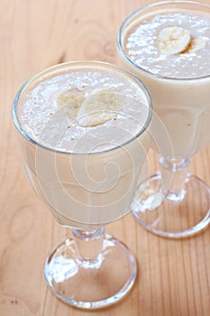 Two glasses of fresh banana smoothies