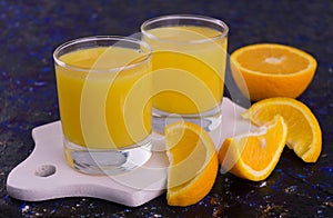 Two glasses of fresh organic orange juice. Close-up.