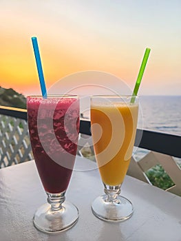 Two glasses of fresh smoothies on restaurant table, Rhodes island, Greece