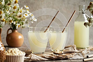 Two glasses of fresh whey on a table