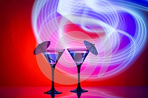 Two glasses of martini coctail in a bar