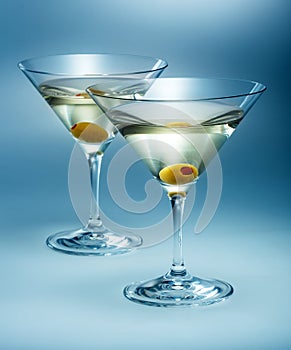 Two glasses martini with olive. cocktail isolated photo