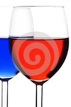 Two glasses of red and blue liquid