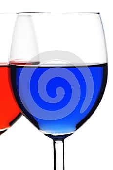 Two glasses of red and blue liquid