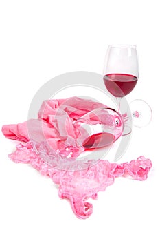 Two glasses of red wine near pink panties