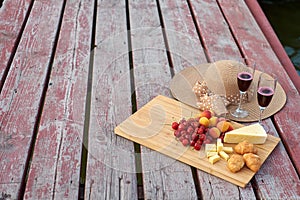 Two glasses of red wine, served outdoor with fruits