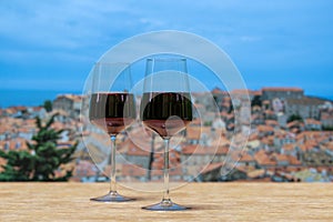 Two glasses of red wine with view of Dubrovnik