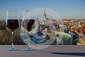 Two glasses of red wine with view of Tallinn Old Town in summer, Estonia