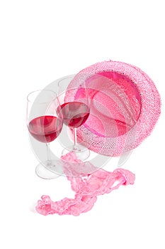 Two glasses of red wine on a white background near pink panties photo