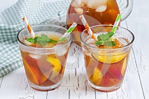 Two glasses of refreshing peach iced tea