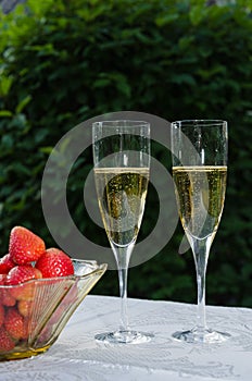 Two glasses with sparkling wine and strawberries