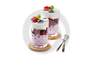 Two glasses with strawberry and blueberry dessert