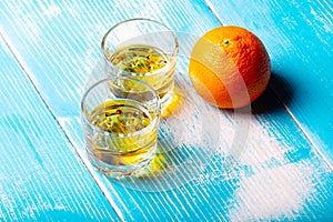 Two glasses on the table and orange fruit