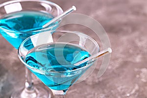 Two glasses of trendy blue wine with paper straws photo