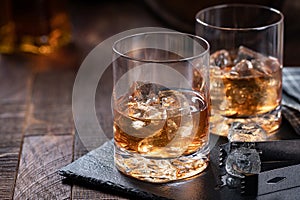 Two glasses of whiskey on ice