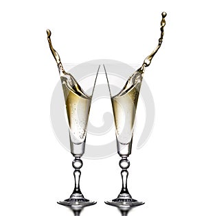 Two glasses on a white background. Glasses of champagne. Splash.