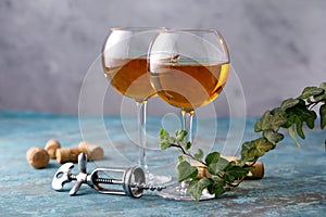 Two glasses with white wine on a textural background. Copy space. Place for your text