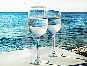 Two glasses of wine on beach