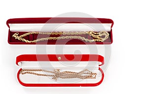 Two gold chains in gift boxes