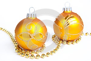 Two gold christmas ball and gold decoration, isola