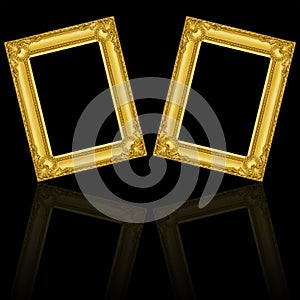 two gold wooden frames isolated on black with reflection