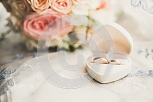 Two golden wedding rings isolated background concept