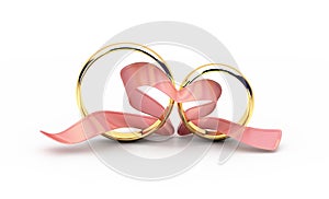 Two golden wedding rings with a pink ribbon in a heart shape