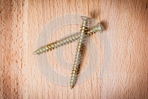Two goldish screws photo